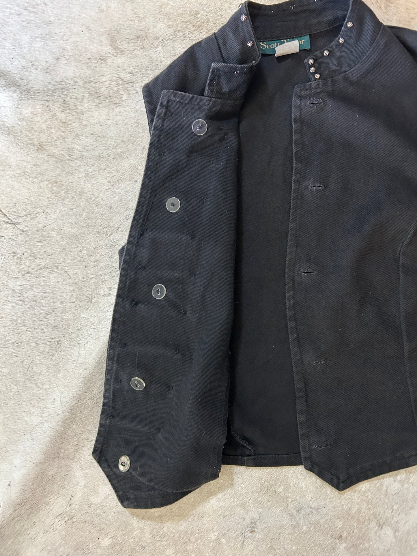 Black jean vest with bone bead detail
