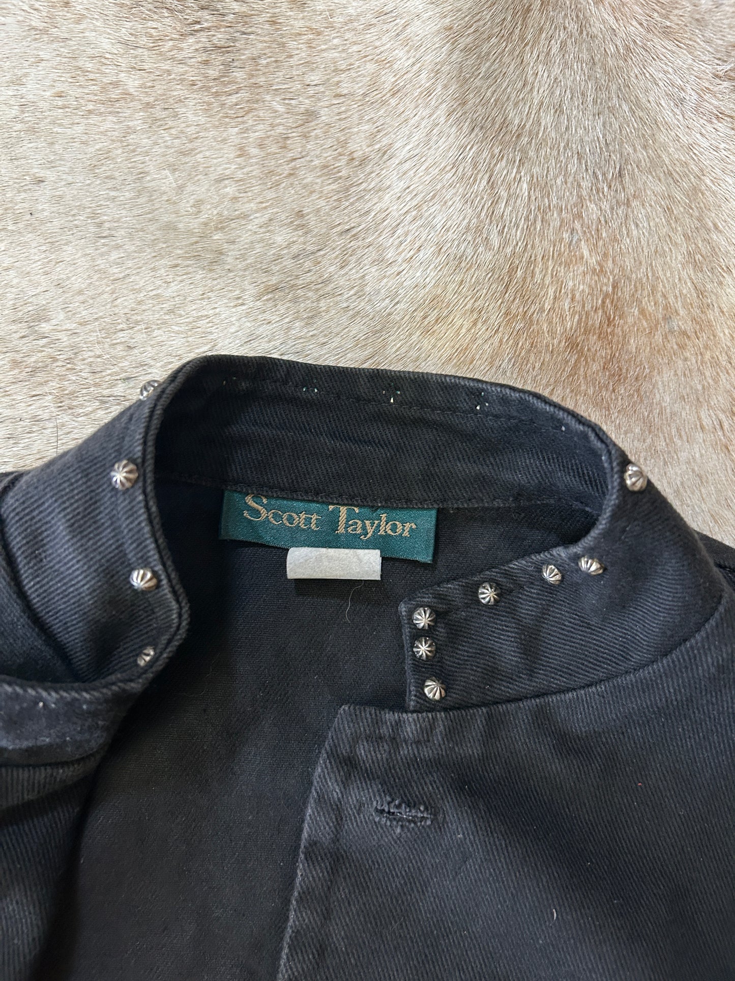 Black jean vest with bone bead detail
