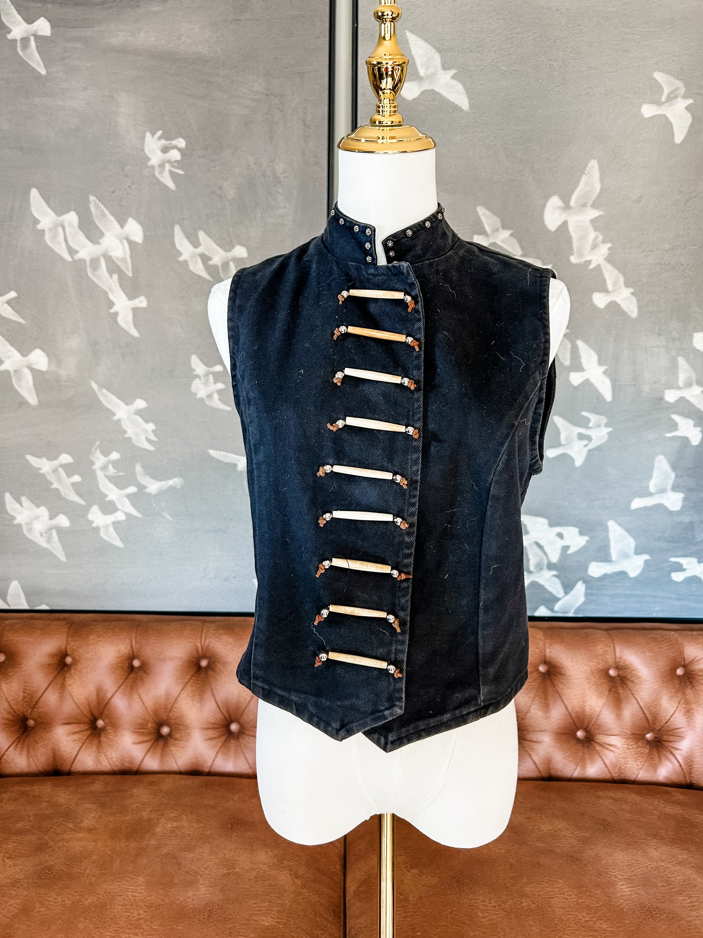 Black jean vest with bone bead detail