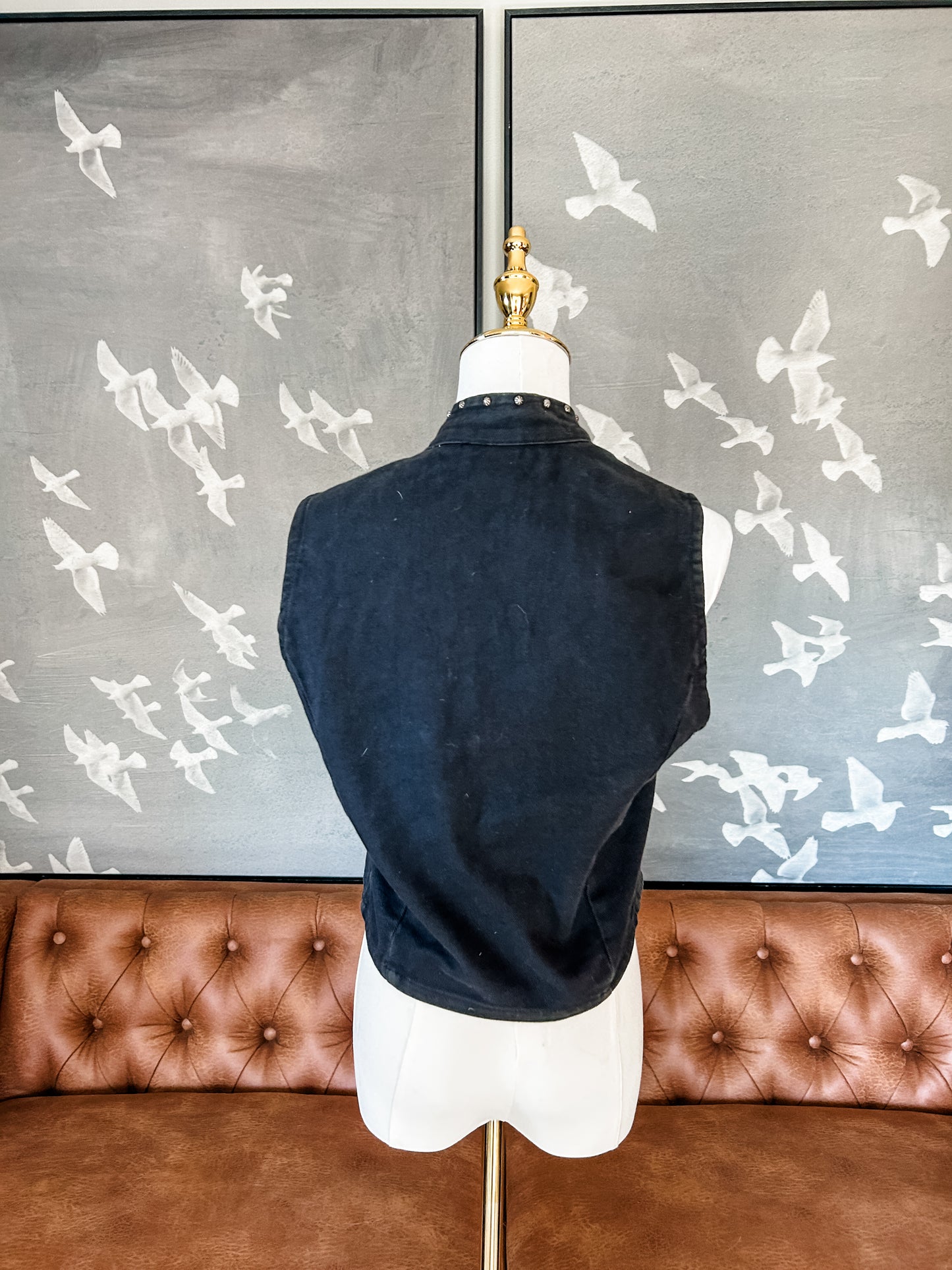 Black jean vest with bone bead detail